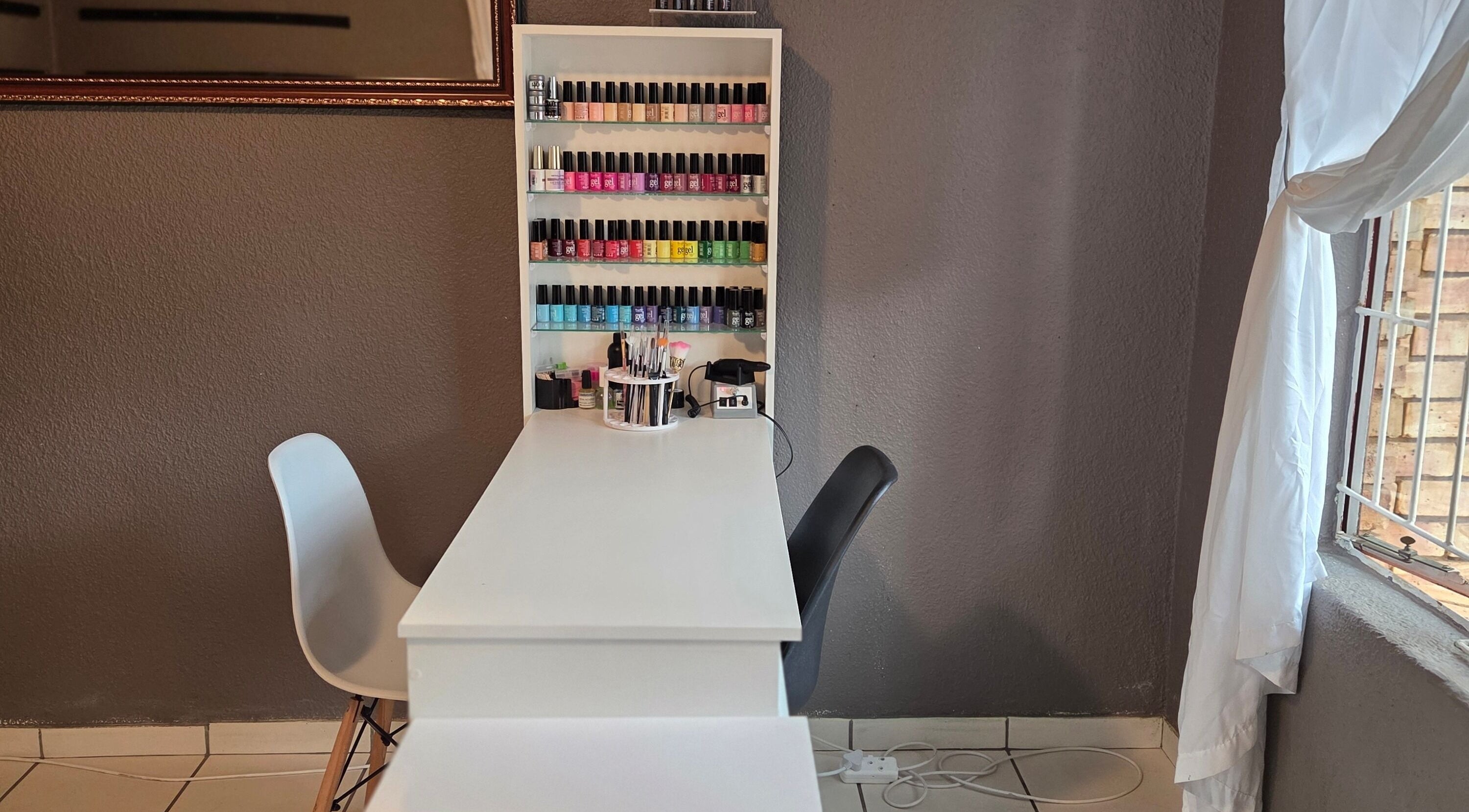 Elegant nail polish display at Pretty Claws by Melisha, Rustenburg, North West, ZA offering a serene beauty experience.