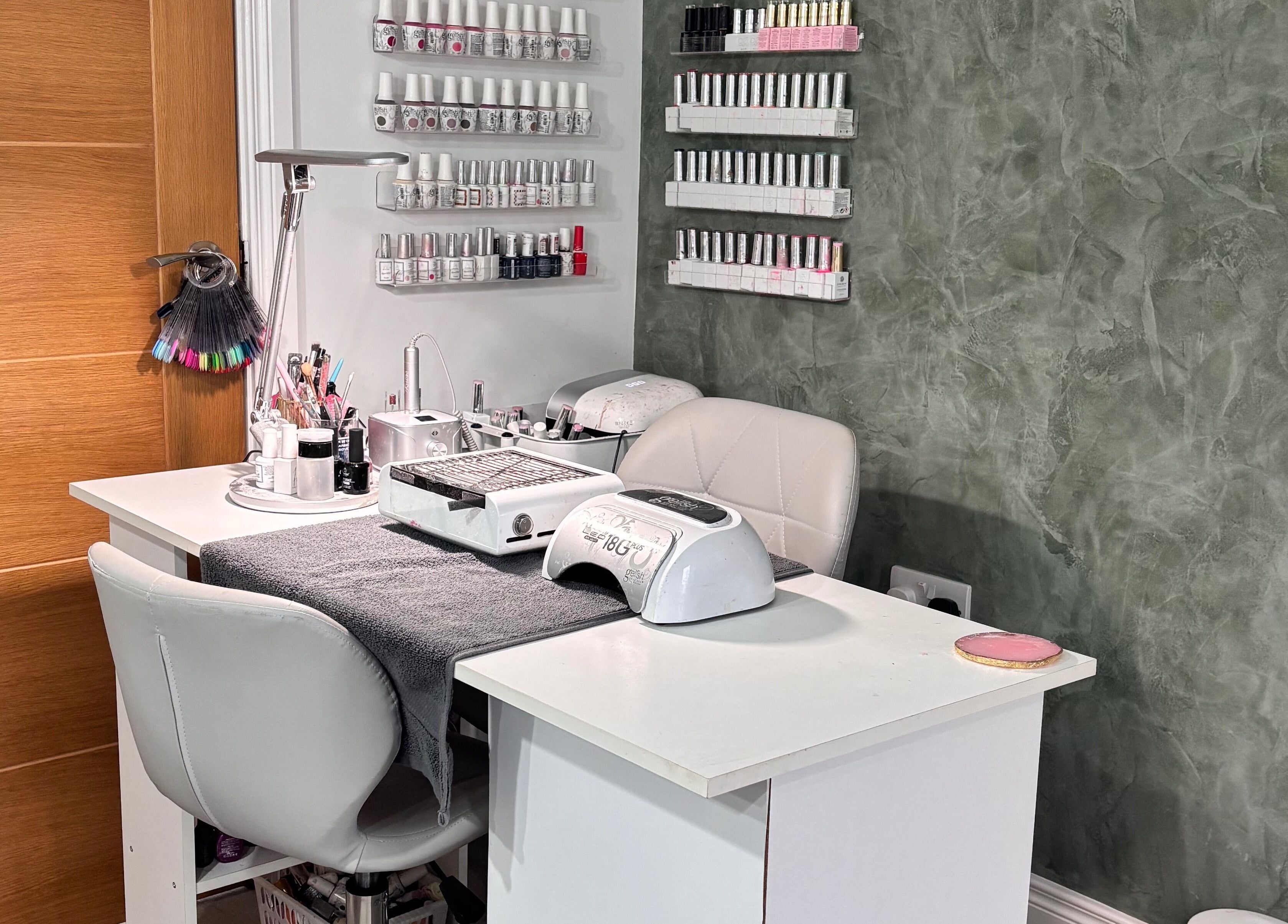 Nail station at SD Makeup Artistry, Castlereagh with gel polish on display and modern decor.