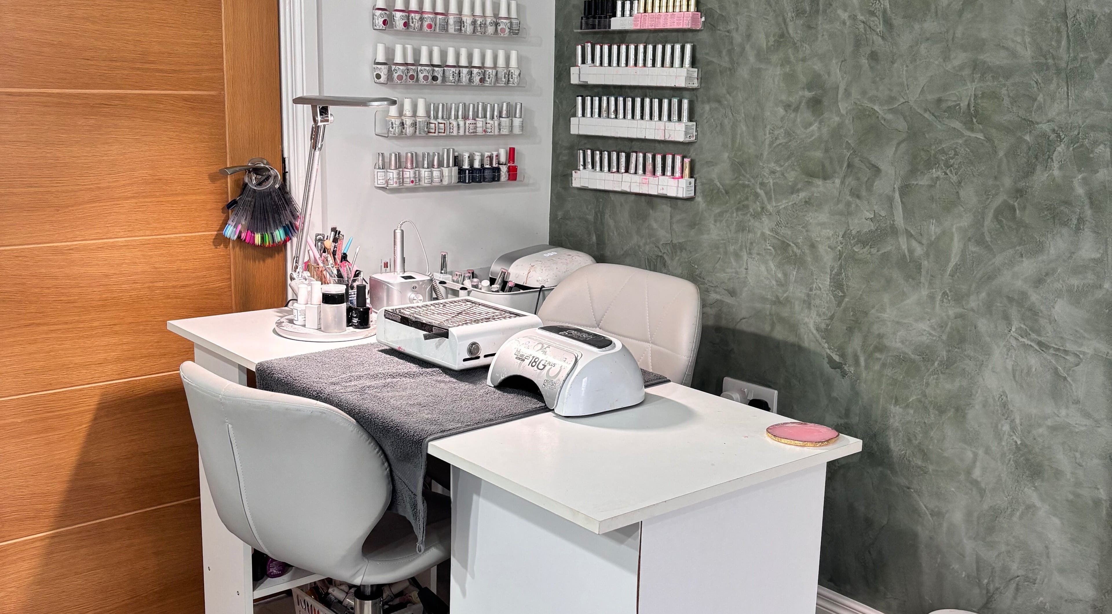 Nail station at SD Makeup Artistry, Castlereagh with gel polish on display and modern decor.