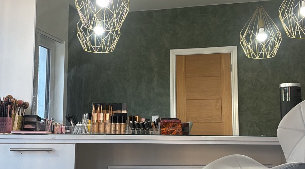 Stylish makeup station at SD Makeup Artistry in Castlereagh, Northern Ireland, GB with elegant lighting.