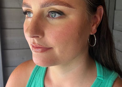 Close-up of a woman's serene face at Ivy Bloom, Coggeshall, England, GB showcasing natural makeup.