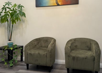 Relaxing lounge area with green chairs at Bosmar Spa, San Diego, California, US.