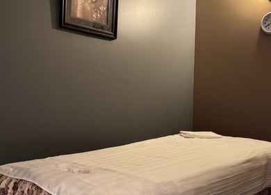 Relaxing spa room at Bosmar Spa in San Diego, California, US, featuring a massage bed and calm decor.