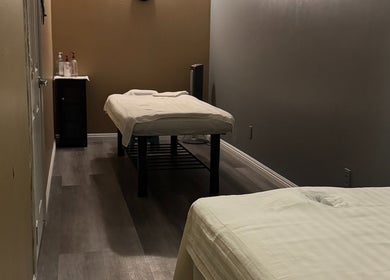 Relaxing massage room at Bosmar Spa in San Diego, California, US with two treatment tables.