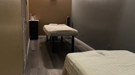 Relaxing massage room at Bosmar Spa in San Diego, California, US with two treatment tables.