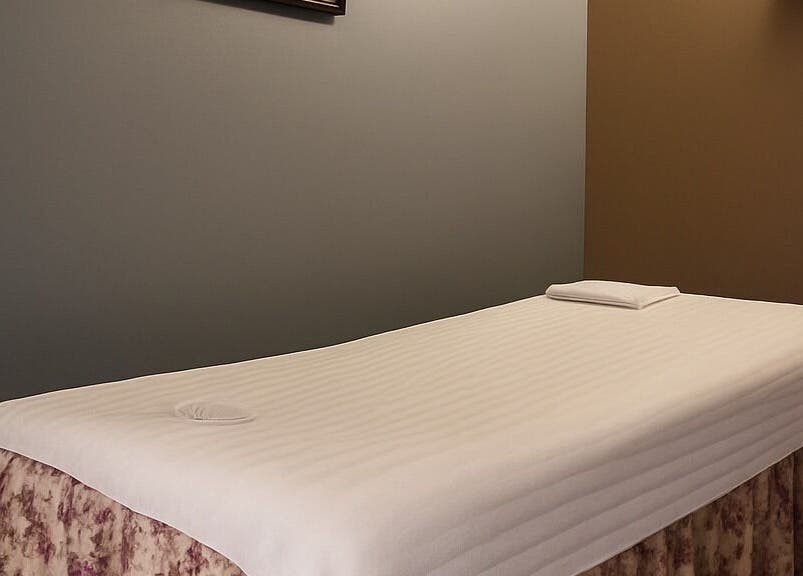 Massage table in a tranquil room at Bosmar Spa, San Diego, California, US, promising relaxation.