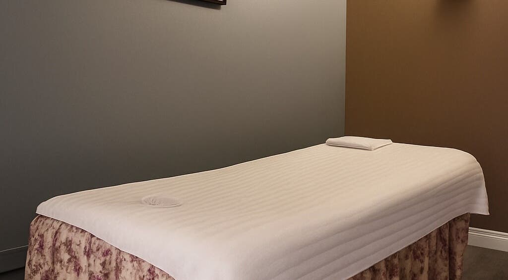 Massage table in a tranquil room at Bosmar Spa, San Diego, California, US, promising relaxation.