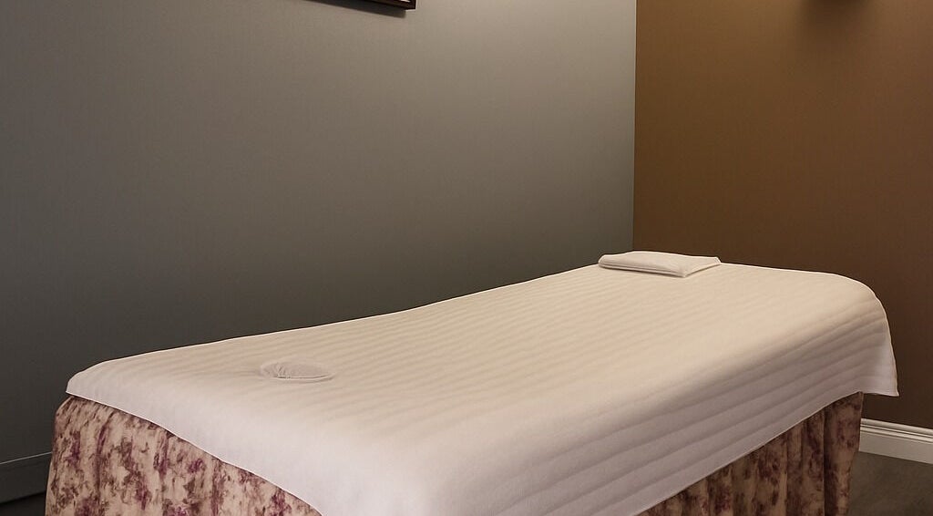 Massage table in a tranquil room at Bosmar Spa, San Diego, California, US, promising relaxation.