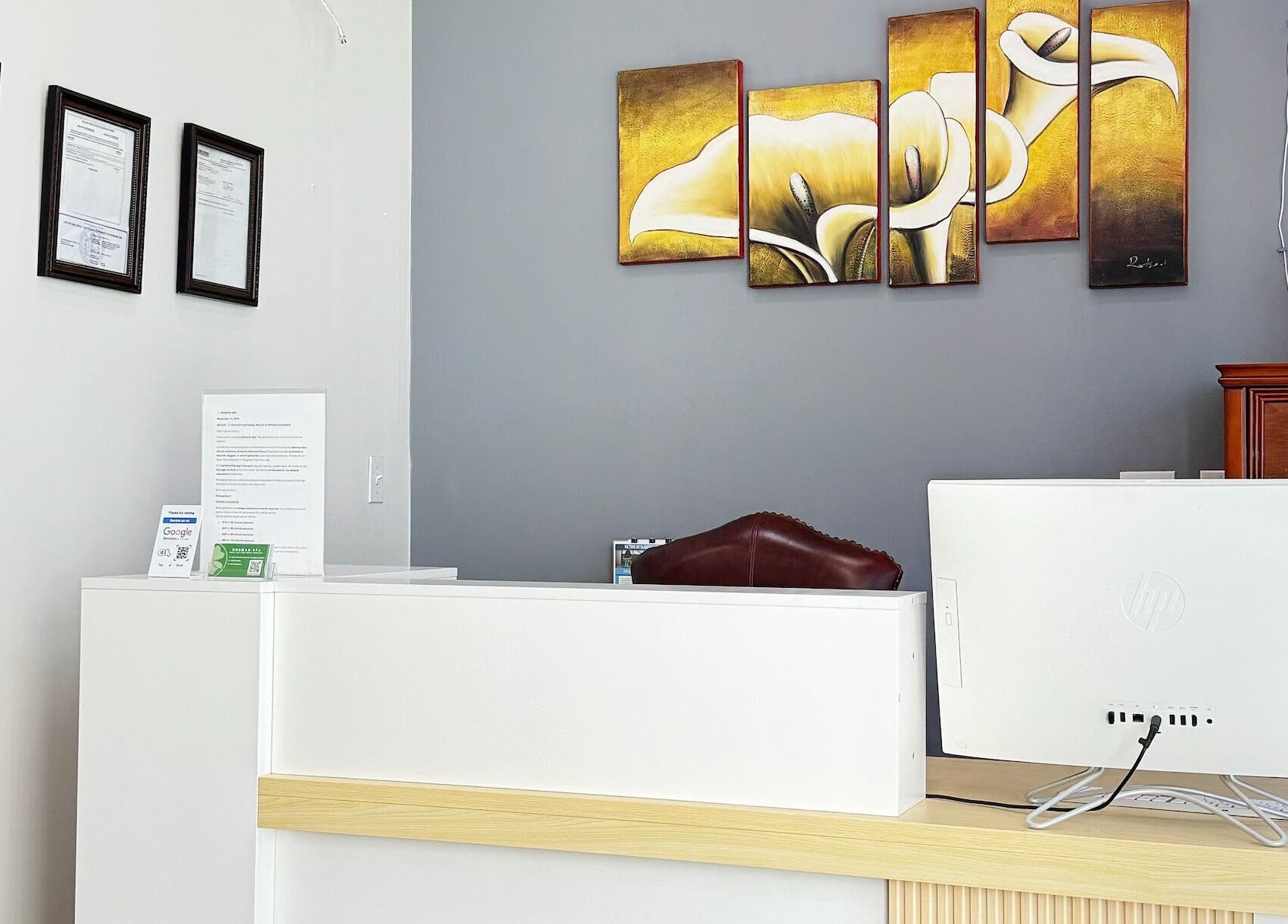 Reception desk at Bosmar Spa in San Diego, California, US with modern decor and art.