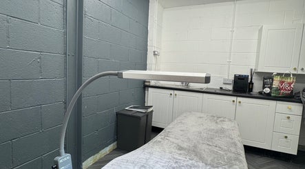Modern treatment room at House of Gaia, Aberbargoed, Wales, GB with sleek decor and comfortable setup.