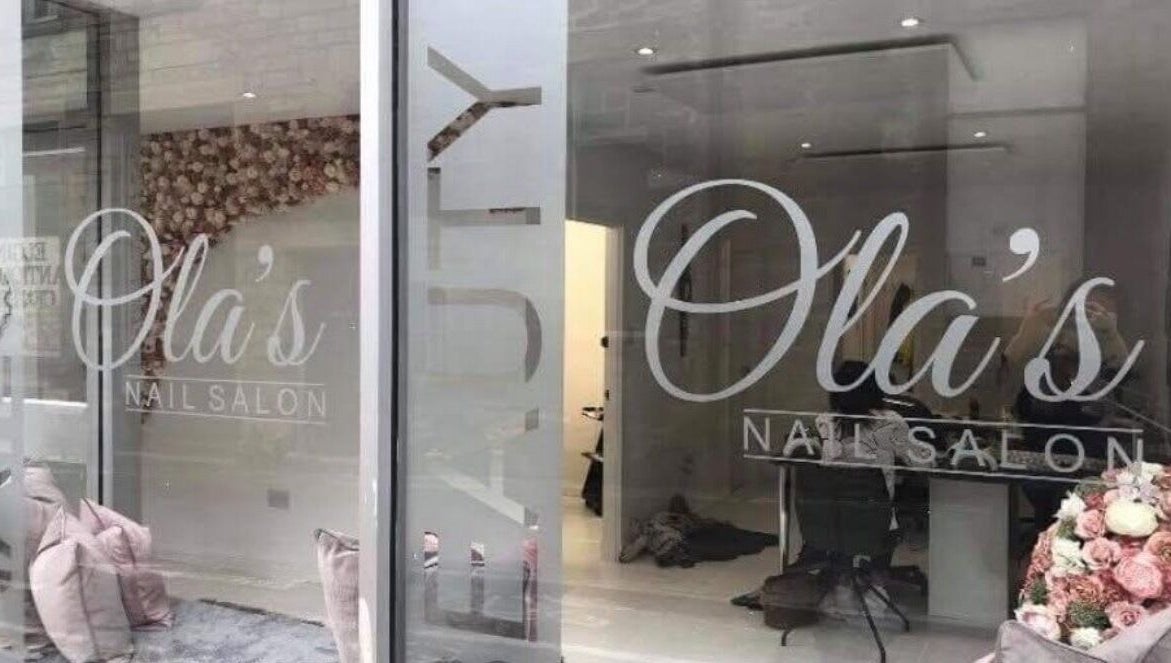 Chic window display of Nails By Kc at Elgin, Scotland, GB with elegant salon interior.