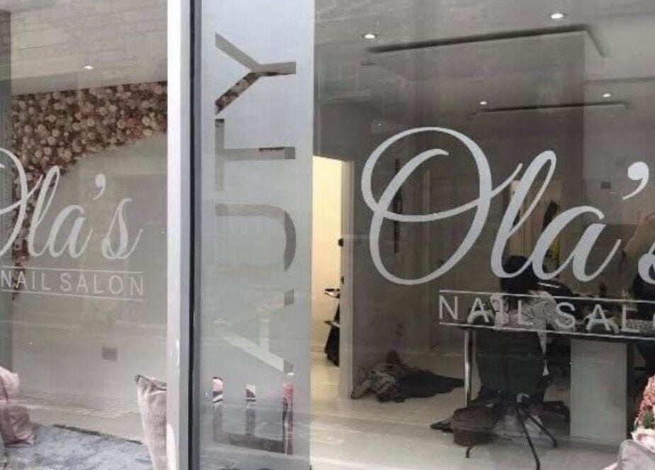 Chic window display of Nails By Kc at Elgin, Scotland, GB with elegant salon interior.