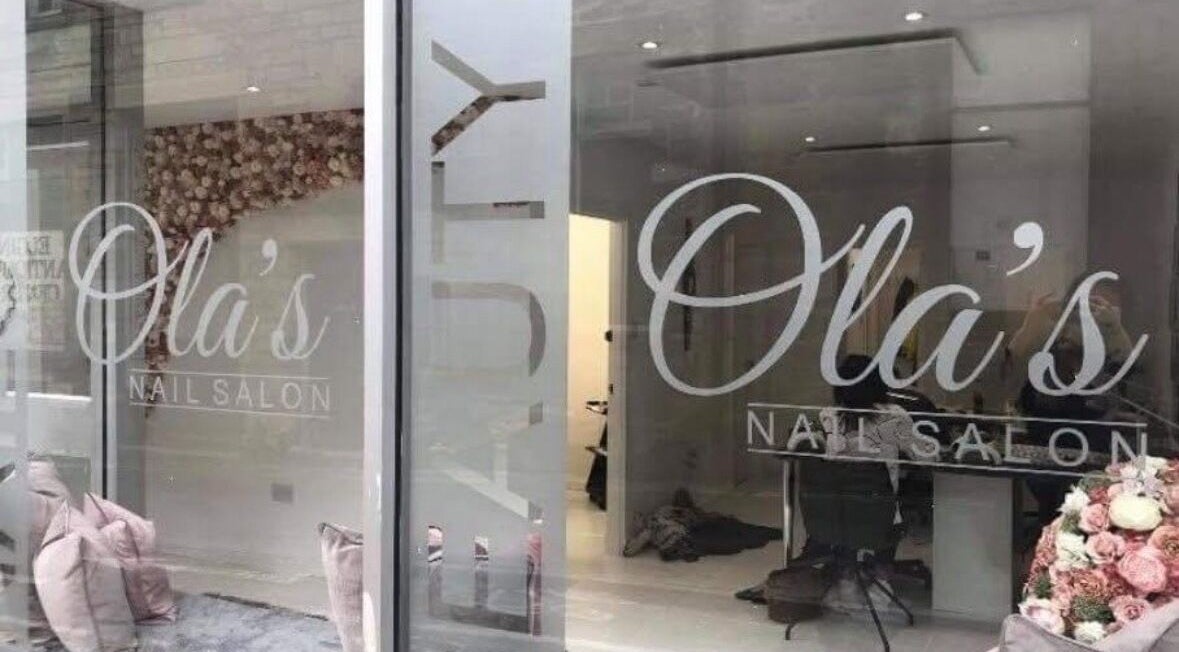 Chic window display of Nails By Kc at Elgin, Scotland, GB with elegant salon interior.