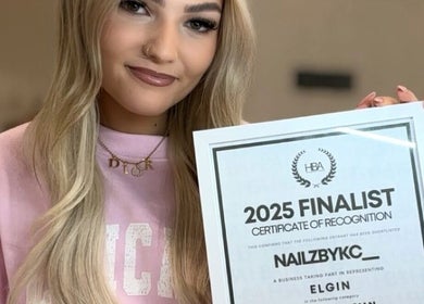 Nails By Kc in Elgin, Scotland displays a finalist certificate, showcasing achievement in beauty excellence.