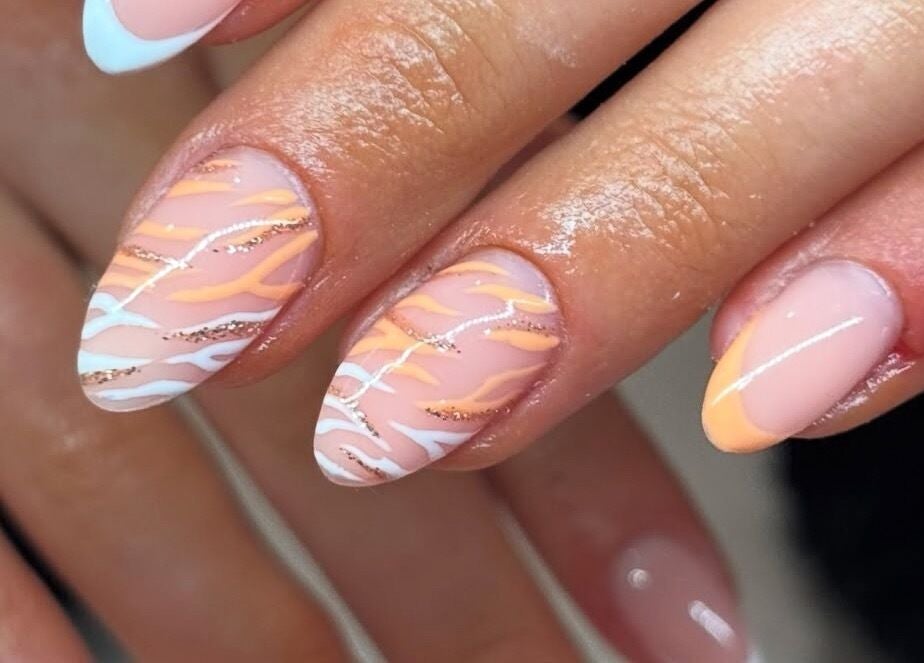 Artistic nail design at Nails By Kc in Elgin, Scotland, GB showcasing vibrant color patterns.