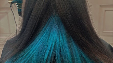 Blue-streaked hair styled at Becky’s Hairdressing mobile, Woodsetts, England, GB.