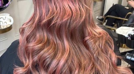 Vibrant wavy pink and brown hair styled at Becky’s Hairdressing mobile in Worksop, England, GB.