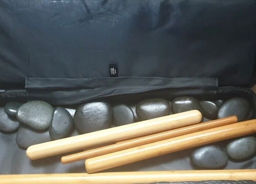 Massage stones and bamboo sticks at Trudy Wilson Mobile Massage and Holistic Therapies, Larbert, Scotland, GB.