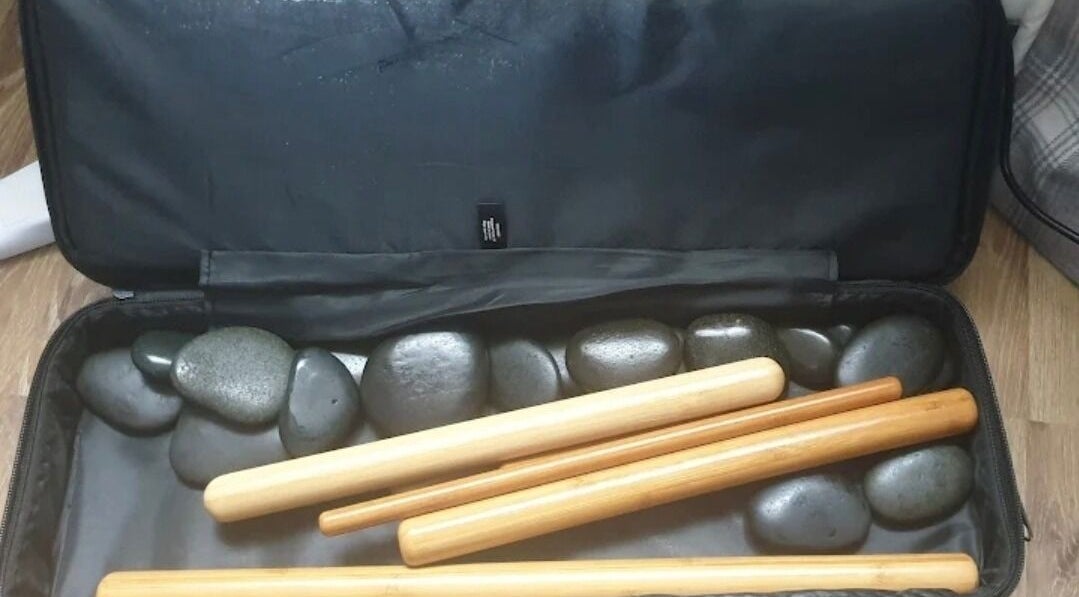 Massage stones and bamboo sticks at Trudy Wilson Mobile Massage and Holistic Therapies, Larbert, Scotland, GB.