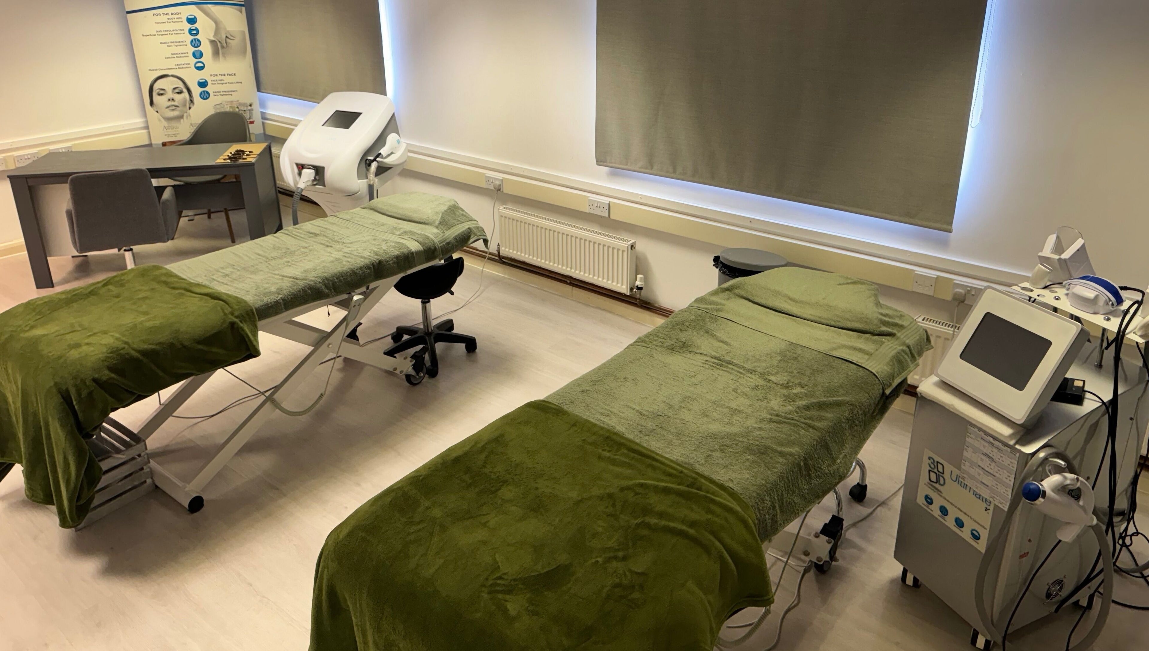 Treatment room at Harmony Clinic, Woodbridge, England, GB, featuring luxury massage tables and advanced equipment.