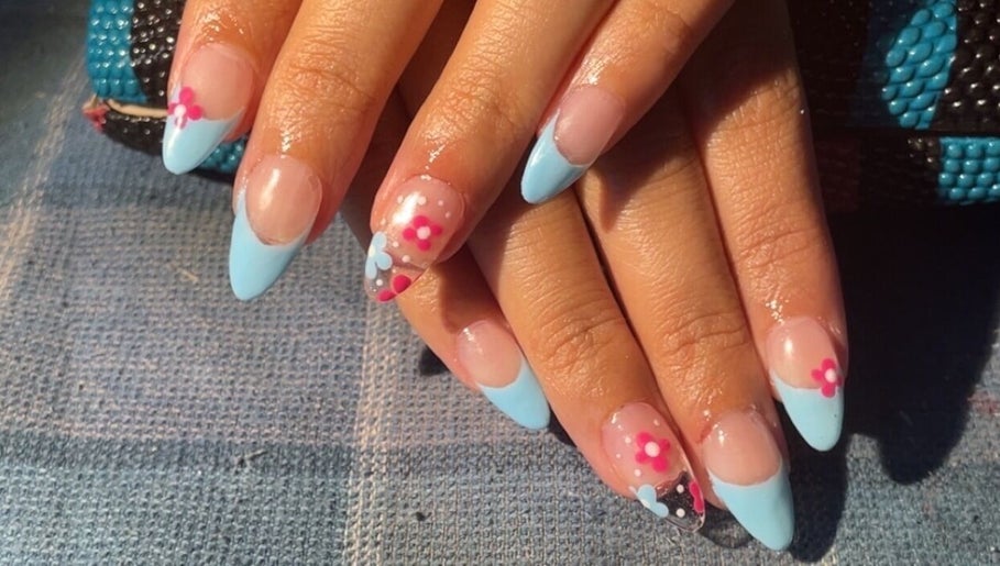 Stylish floral and blue nail art by painted.by.samii in Wesley Chapel, Florida, US.