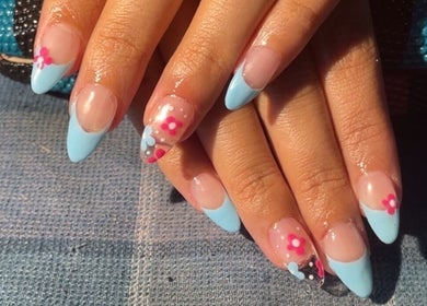 Stylish floral and blue nail art by painted.by.samii in Wesley Chapel, Florida, US.