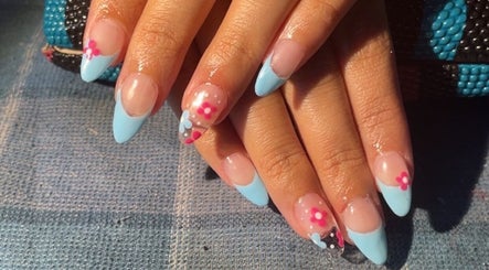 Stylish floral and blue nail art by painted.by.samii in Wesley Chapel, Florida, US.
