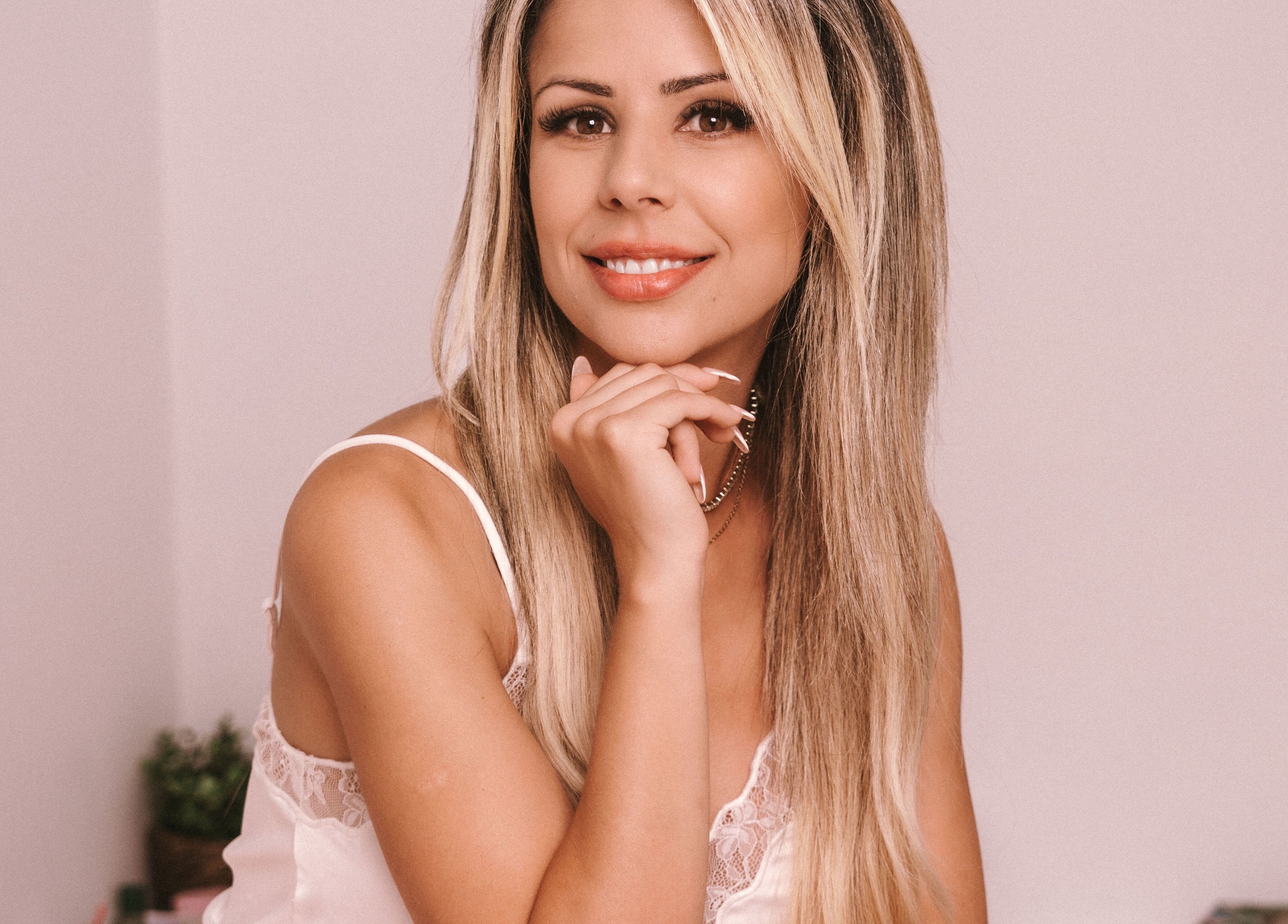 Smiling woman with long hair at Lashes By Juli, Rockdale, New South Wales, AU.