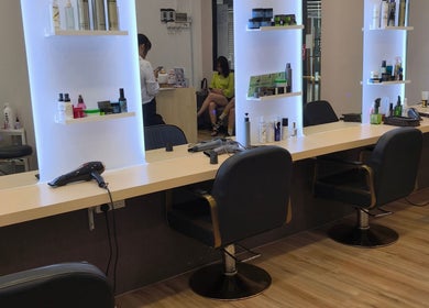 Modern styling station at Inspiration Salon in Kuching, Sarawak, MY, featuring chic design and professional equipment.