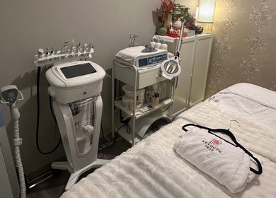 Treatment room at Reyouth Skin Beauty Care, Singapore, SG, featuring advanced skincare equipment and cozy amenities.