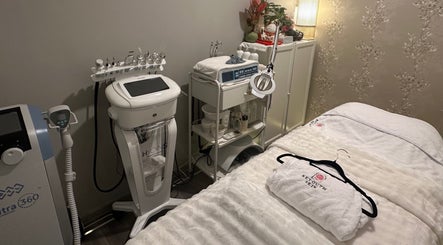 Treatment room at Reyouth Skin Beauty Care, Singapore, SG, featuring advanced skincare equipment and cozy amenities.