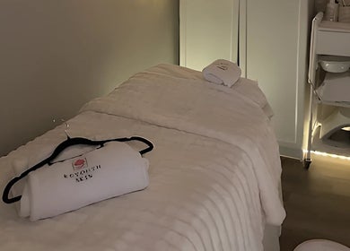 Tranquil treatment room at Reyouth Skin Beauty Care, Singapore, Singapore, SG with cozy bed and towels.