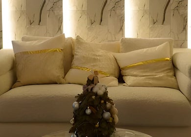 Luxurious seating area at Reyouth Skin Beauty Care, Singapore, SG with plush pillows and elegant decor.