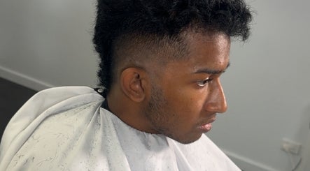 Profile of a man receiving a precision haircut at Studio M Barbers, Melbourne, Victoria, AU.