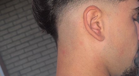 Fresh fade haircut at Studio M Barbers in Melbourne, Victoria, AU. Clean and precise style.