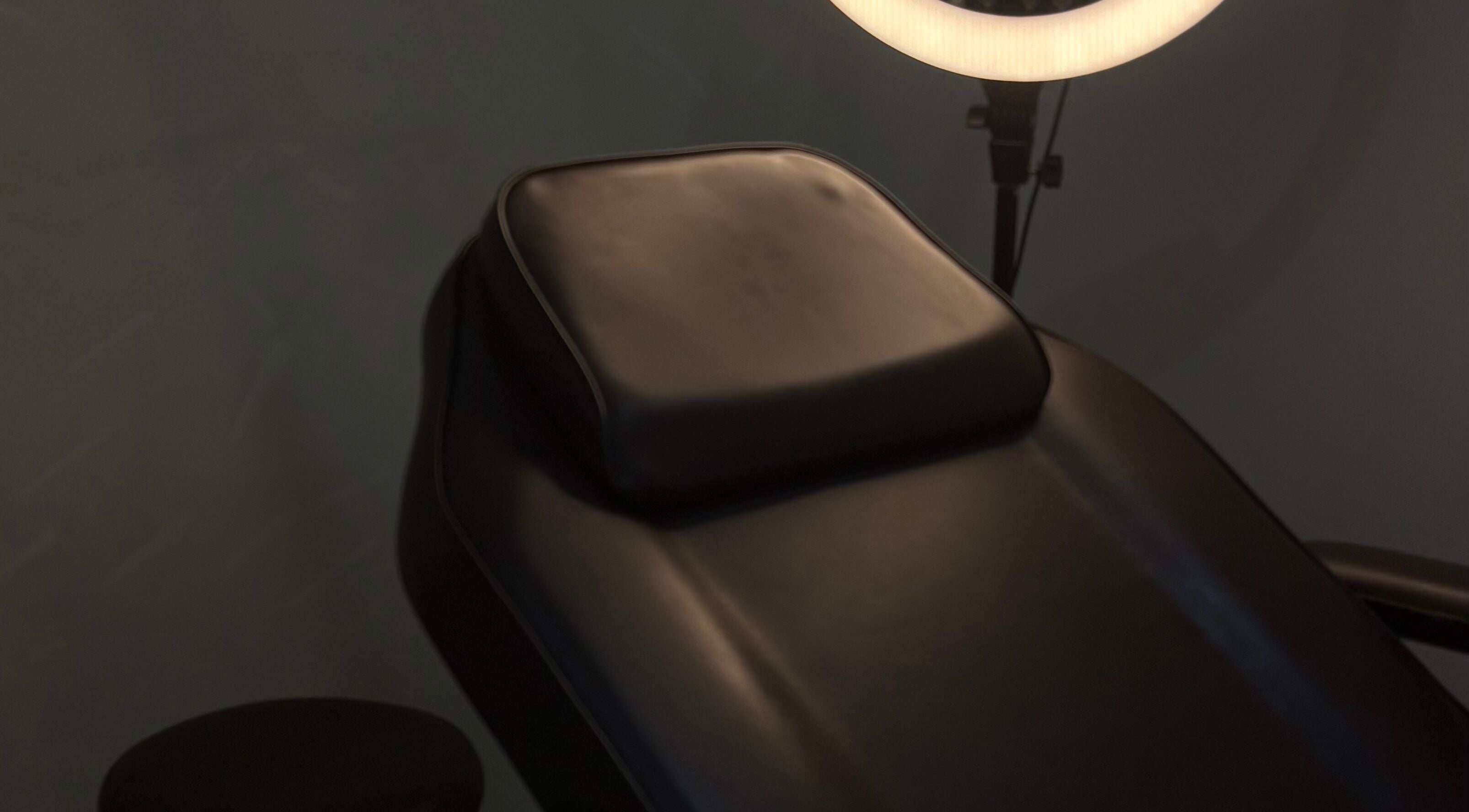 Comfortable treatment chair under soft light at Duda Flores Beauty, Surfers Paradise, Queensland, AU.