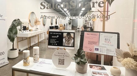 Interior view of KeratinbyYing @apt.hair in Richmond, Victoria, AU, showcasing modern salon decor and promotional materials.