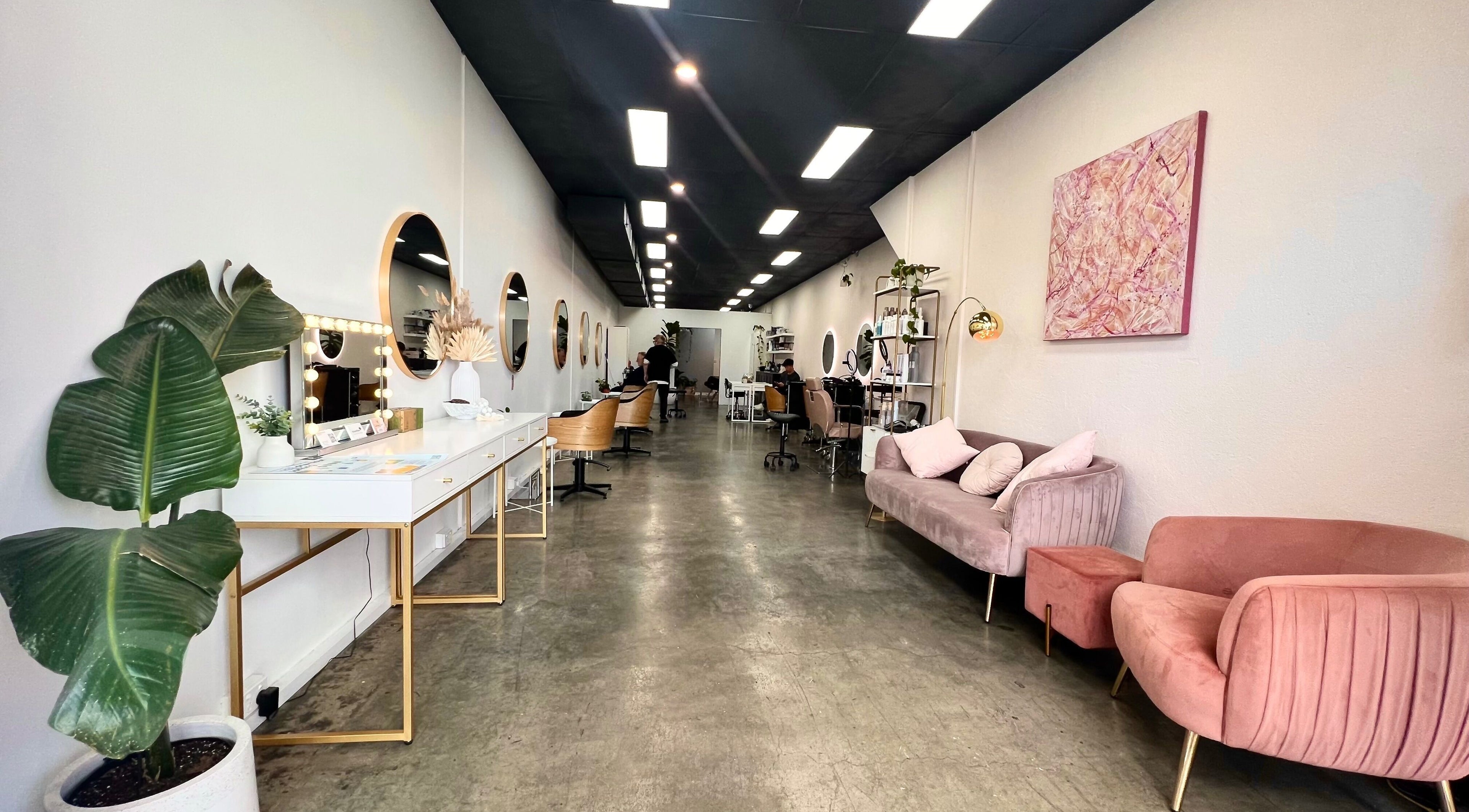 Elegant salon interior at Keratin by Ying at Apt Hair, Richmond, Victoria, AU. Modern decor and plush seating.