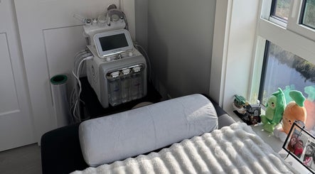 Relaxing treatment room at Island Beauty Labs, Nanaimo, British Columbia, CA with plush bedding and equipment.
