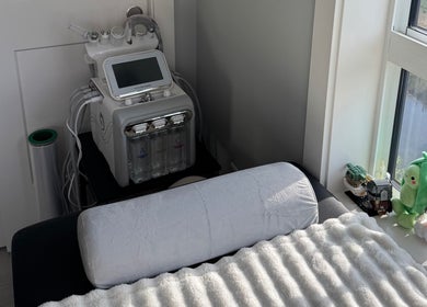 Relaxing facial treatment setup at Island Beauty Labs, Nanaimo, British Columbia, CA with plush decor.