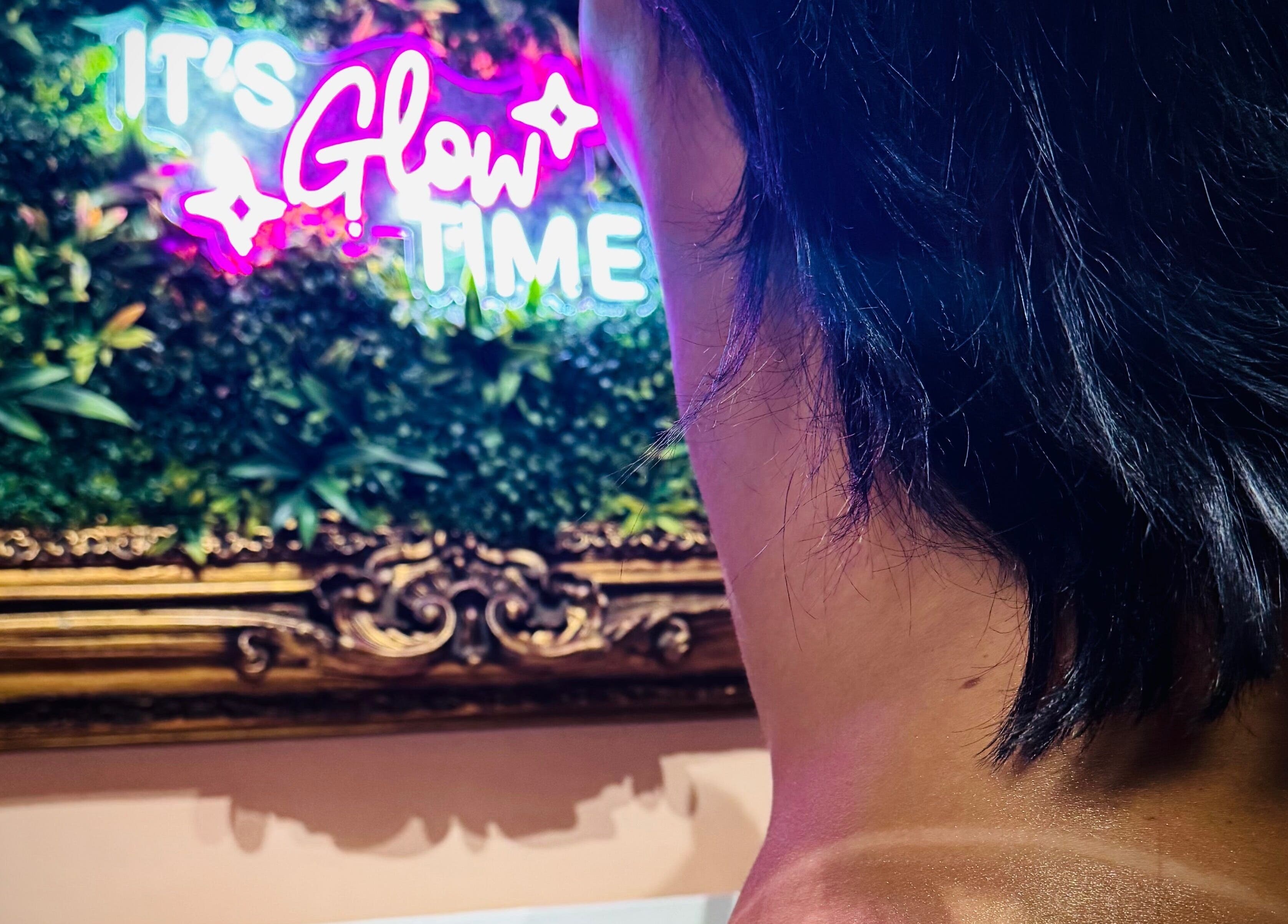 Neon 'Glow Time' sign at Tan with Topps, Torquay, England, GB