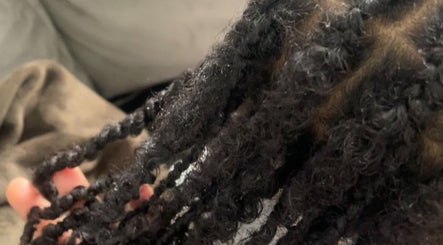 Close-up of beautifully styled curls at Cultured Curls, London, England, GB. Perfect for natural hair care.