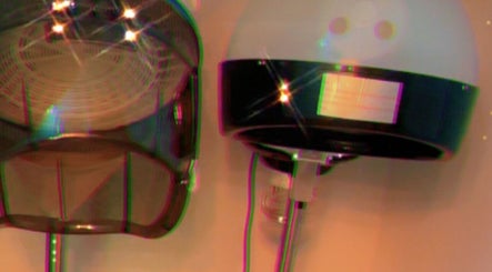 Hair dryers at Cultured Curls salon in London, England, GB, offering professional styling.