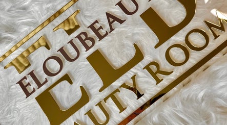 E.loubeauty sign with gold lettering on white fur background, Poole, England, GB.