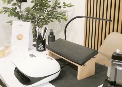 Nail station setup at Nails By Mali in Llandybie, Wales, GB, showcasing tools and decor.