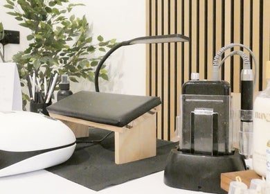 Elegant nail station at Nails By Mali, Llandybie, Wales, GB, featuring tools and greenery for a serene experience.