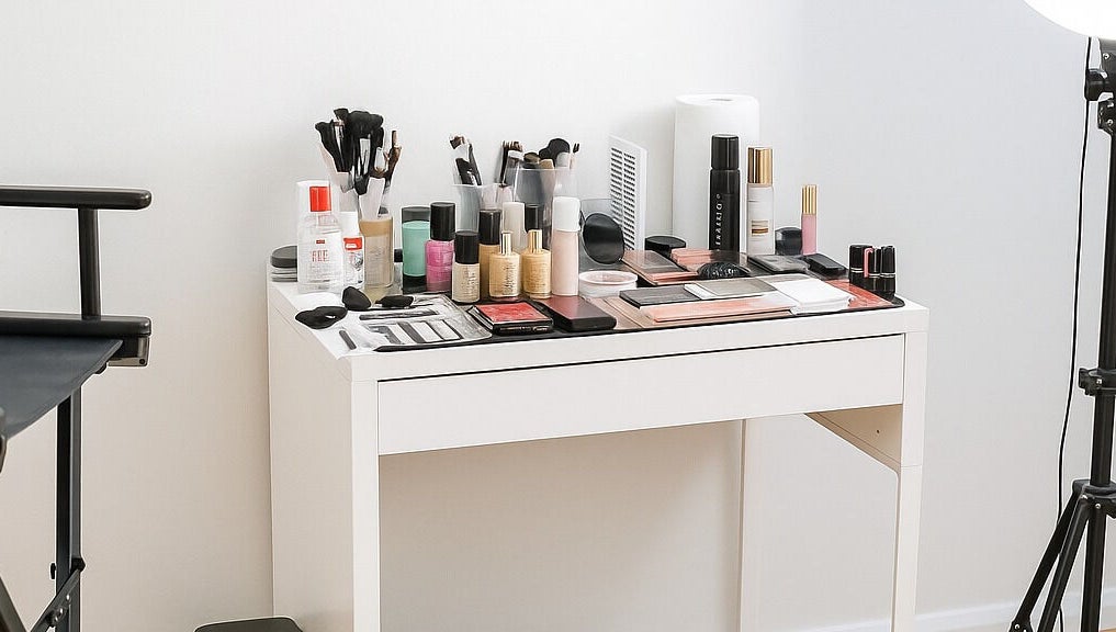 Makeup setup at Makeup By Georges, Pymble, New South Wales, AU. Brushes, palettes, and products on a tidy table.