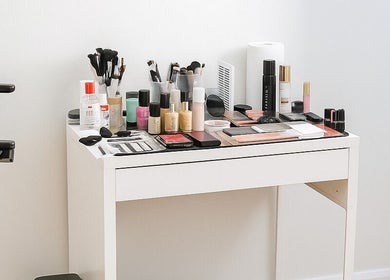 Makeup setup at Makeup By Georges, Pymble, New South Wales, AU. Brushes, palettes, and products on a tidy table.