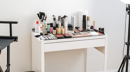 Makeup setup at Makeup By Georges, Pymble, New South Wales, AU. Brushes, palettes, and products on a tidy table.