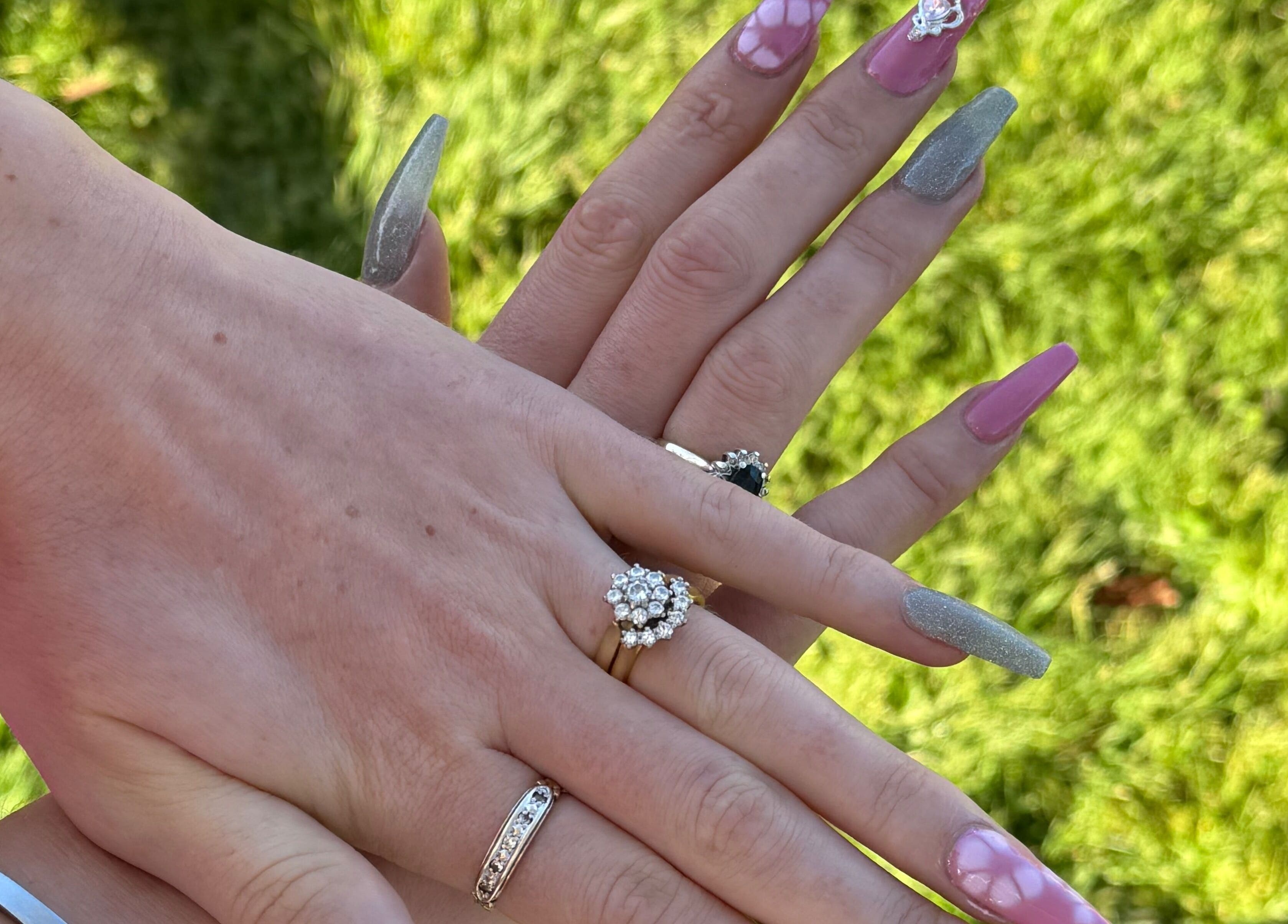 Elegant manicured hands with rings at Ethereal Nails, Eyrewell Forest, Canterbury Region, NZ.